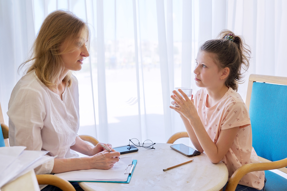 Child Girl at Session with Social Worker, School Psychologist in Office